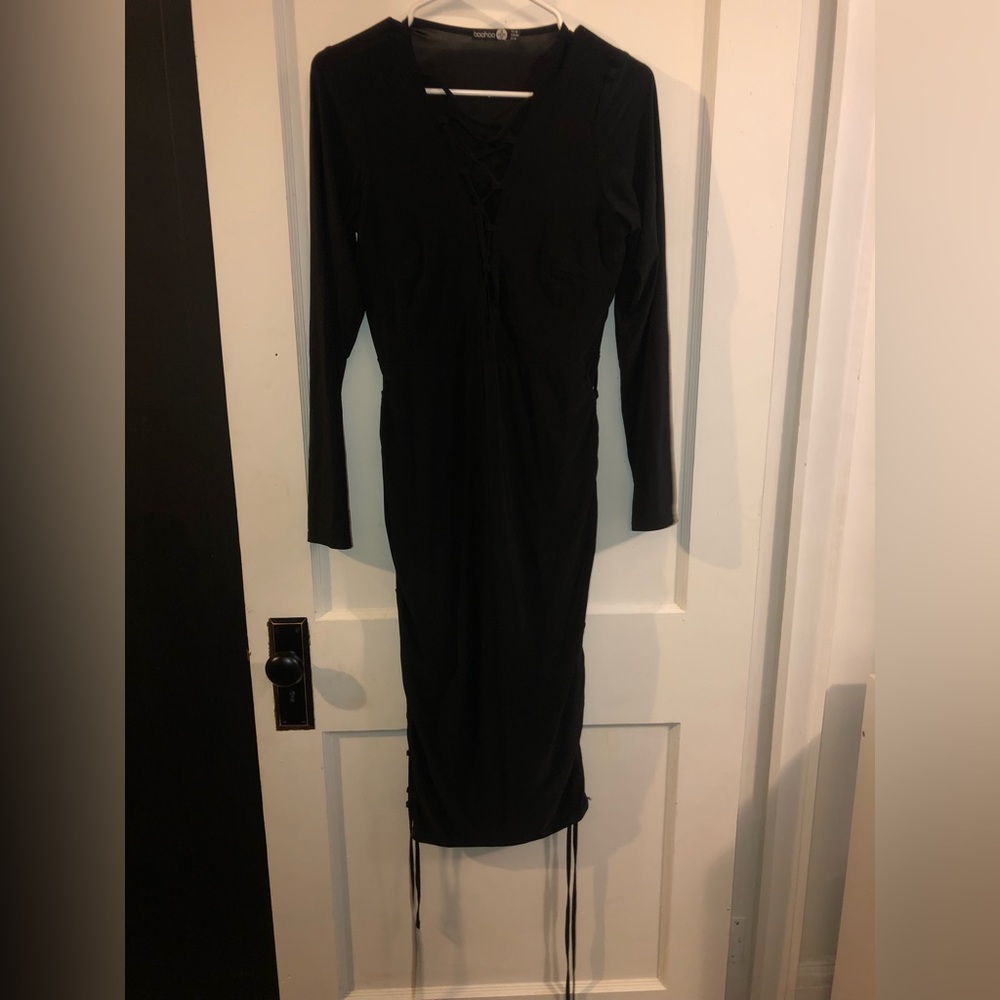 Black dress with tied detailing on the sides